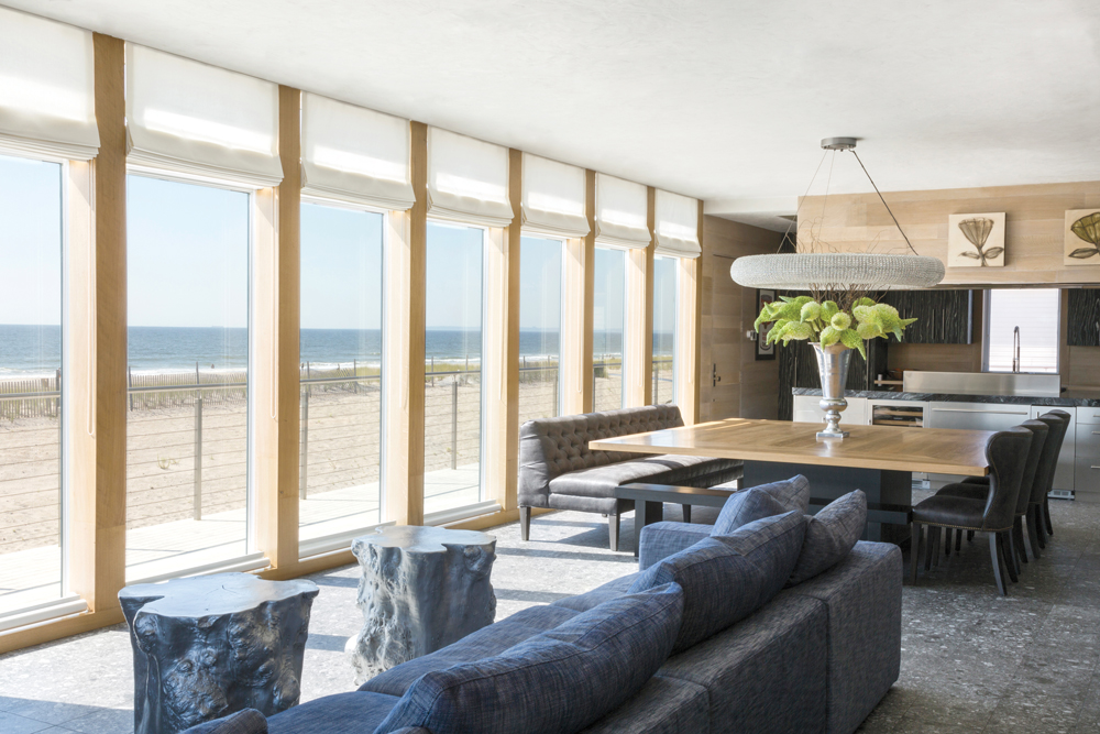 Modern yet cozy furniture invites guests to relax and let the beachside views take center stage.